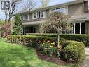 Two-story residence featuring horizontal siding, white window shutters, and a covered entry with white columns - 514 Colonial Drive, Waterloo, ON  - Outdoor 