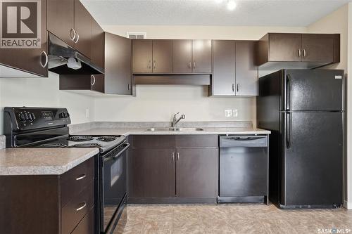 106 5521 Blake Crescent, Regina, SK - Indoor Photo Showing Kitchen With Double Sink