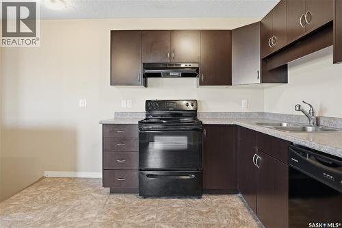 106 5521 Blake Crescent, Regina, SK - Indoor Photo Showing Kitchen With Double Sink