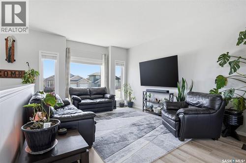 330 Player Crescent, Warman, SK - Indoor Photo Showing Living Room With Fireplace
