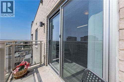 Private balcony featuring a concrete floor, glass and metal railings, and a sliding glass door entry - 246 Lester Street Unit# Ph-03, Waterloo, ON - Outdoor With Balcony With Exterior
