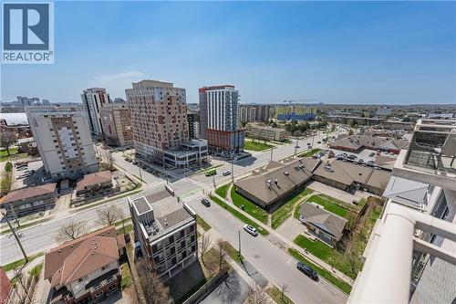 Expansive aerial perspective showcasing a vibrant urban environment with diverse architectural styles, including multi-story residential buildings and commercial structures - 246 Lester Street Unit# Ph-03, Waterloo, ON - Outdoor With View