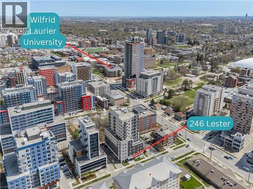 Aerial overview of a dense urban environment featuring multi-story residential and commercial buildings - 246 Lester Street Unit# Ph-03, Waterloo, ON - Outdoor With View