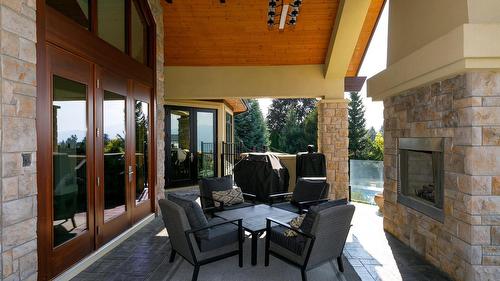 4326- 4330 Bedford Lane, Kelowna, BC - Outdoor With Fireplace With Deck Patio Veranda With Exterior