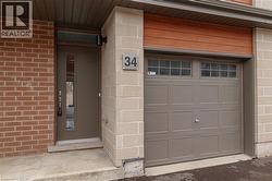 Exterior featuring a brick facade and light-colored block accents - 