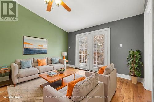 virtually staged - back family room - 506 Wentworth Avenue, Ottawa, ON - Indoor Photo Showing Living Room