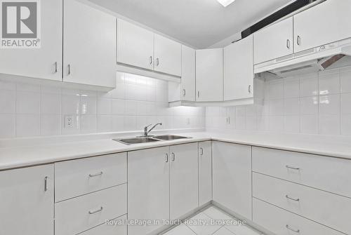 Virtually Staged - 32 Tiny Beaches Road S, Tiny, ON - Indoor Photo Showing Kitchen With Double Sink
