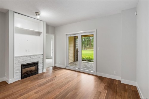 #113-1400 Lynburne Pl, Langford, BC - Indoor Photo Showing Living Room With Fireplace