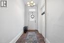 Entryway featuring tile flooring, white walls, and a multi-light ceiling fixture - 137 Market Street, Hamilton, ON  - Indoor Photo Showing Other Room 