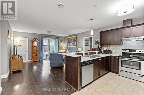 106 - 26 Wellington Street, St. Catharines (Downtown), ON - Indoor Photo Showing Kitchen With Double Sink