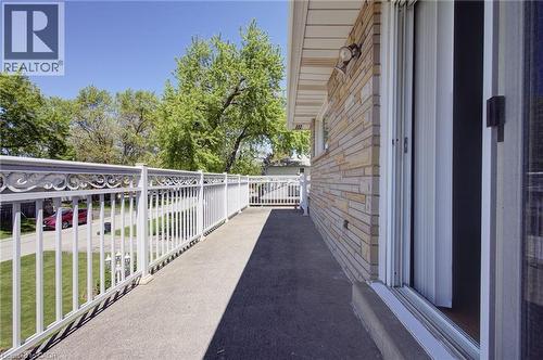 Exterior balcony featuring decorative white railings and a multi-tone stone facade - 2344 Brinell Avenue, Burlington, ON - Outdoor With Exterior