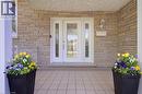 Stone veneer exterior featuring a white entry door with decorative glass inserts and sidelights - 2344 Brinell Avenue, Burlington, ON  -  Photo Showing Other Room 