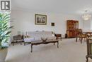 Spacious living area featuring light-toned carpeting and crown molding - 2344 Brinell Avenue, Burlington, ON  - Indoor Photo Showing Living Room 