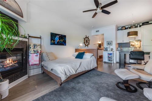 302-2326 Harbour Rd, Sidney, BC - Indoor Photo Showing Bedroom With Fireplace