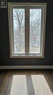 Detailed view of wood finished floors and baseboards - 