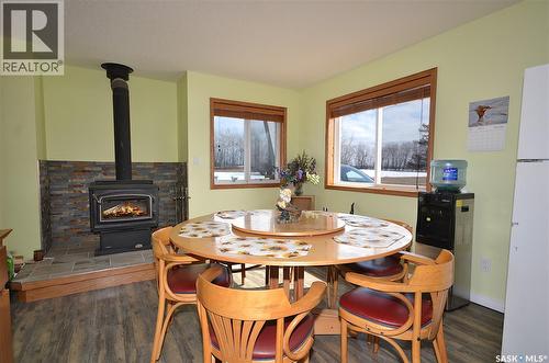 6 Bronco Drive, Delaronde Lake, SK - Indoor Photo Showing Dining Room With Fireplace