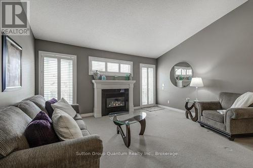 21 - 605 Welland Avenue, St. Catharines (Carlton/Bunting), ON - Indoor Photo Showing Living Room With Fireplace