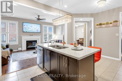 304 Leiterman Drive, Milton, ON - Indoor Photo Showing Kitchen With Fireplace With Double Sink