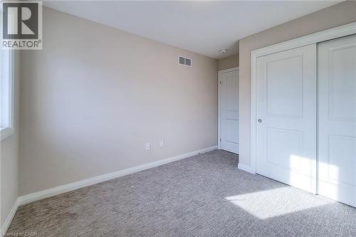 Neutral-toned carpeting paired with light beige walls - 111 Alicia Crescent, Thorold, ON 
