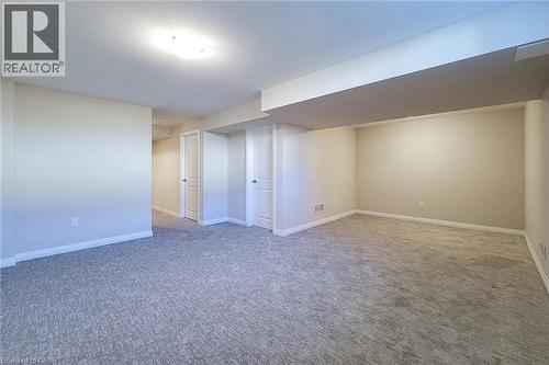 Spacious room featuring neutral carpeting and light-toned wall paint - 111 Alicia Crescent, Thorold, ON 