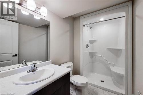 Contemporary bathroom featuring a white vanity with an undermount sink, a white countertop, and a built-in shower with shelving and a grab bar - 111 Alicia Crescent, Thorold, ON 
