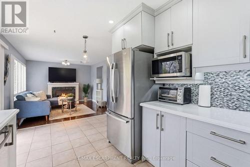 5010 Bunton Crescent, Burlington, ON - Indoor Photo Showing Kitchen With Fireplace With Upgraded Kitchen