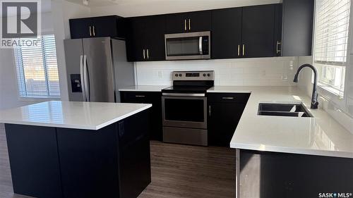 8005 Flax Avenue, Regina, SK - Indoor Photo Showing Kitchen With Stainless Steel Kitchen With Double Sink With Upgraded Kitchen