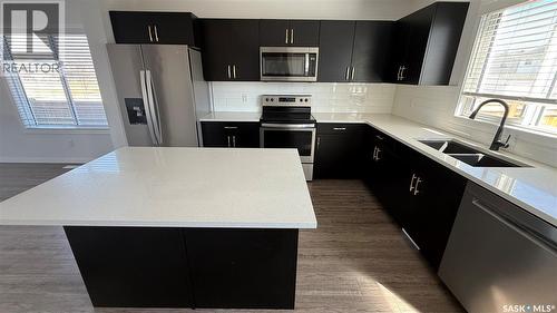 8005 Flax Avenue, Regina, SK - Indoor Photo Showing Kitchen With Stainless Steel Kitchen With Double Sink With Upgraded Kitchen