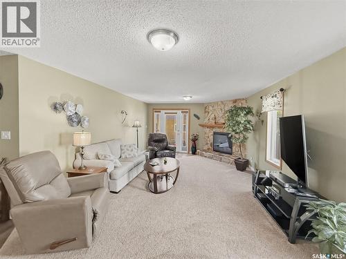 730 6Th Avenue Ne, Swift Current, SK - Indoor Photo Showing Living Room With Fireplace