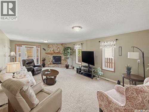 730 6Th Avenue Ne, Swift Current, SK - Indoor Photo Showing Living Room With Fireplace