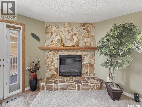 730 6Th Avenue Ne, Swift Current, SK - Indoor Photo Showing Other Room With Fireplace