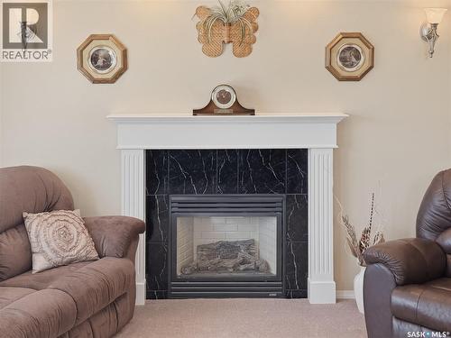530 Palliser Drive, Swift Current, SK - Indoor Photo Showing Living Room With Fireplace