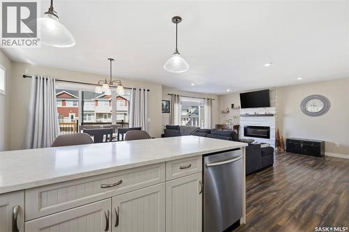 1047 Kolynchuk Crescent, Saskatoon, SK - Indoor Photo Showing Kitchen With Fireplace