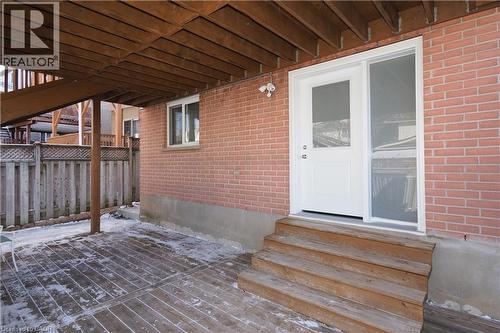 Lower level patio featuring a wood-finish deck and direct access to the interior - 67 Hollyridge Crescent Unit# Lower, Kitchener, ON - Outdoor With Deck Patio Veranda With Exterior