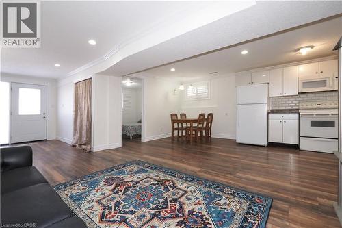 Open-concept living space featuring wood-finish flooring, recessed lighting, and white trim - 67 Hollyridge Crescent Unit# Lower, Kitchener, ON - Indoor
