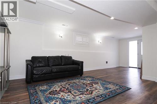 Spacious room featuring wood-finish flooring, white walls, and a recessed lighting track - 67 Hollyridge Crescent Unit# Lower, Kitchener, ON - Indoor Photo Showing Living Room