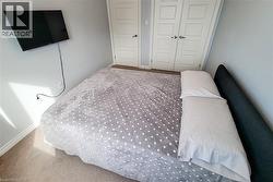 Wall-mounted television with visible power outlet - 