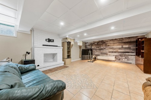 Salle familiale - 494 Rue Fortin, Napierville, QC - Indoor With Fireplace