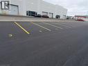 Paved asphalt parking area with clearly delineated yellow parking lines and numerical space markers - 44 Ditton Drive Unit# 3, Hamilton, ON 