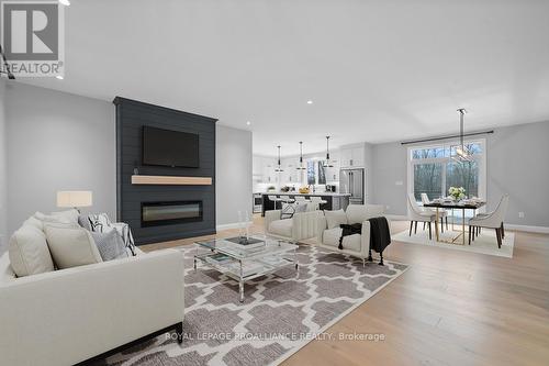 Virtually Staged Photo - 37 Rapids Road, Tweed (Hungerford (Twp)), ON - Indoor Photo Showing Living Room With Fireplace