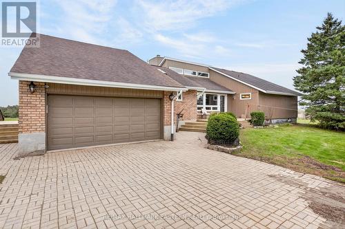 2 car garage & an inviting front porch - 1229 Morton Line, Cavan Monaghan (Cavan Twp), ON - Outdoor