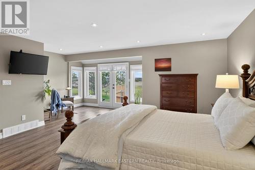 Primary bedroom walkout to the hot tub - 1229 Morton Line, Cavan Monaghan (Cavan Twp), ON - Indoor Photo Showing Bedroom