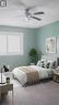 Bedroom featuring a flush-mount ceiling fan with integrated lighting, a large window with white trim, and light-colored carpeting. Virtually staged. - 569 Activa Avenue, Kitchener, ON  - Indoor Photo Showing Bedroom 