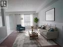 Spacious living area featuring board and batten wall detailing - 569 Activa Avenue, Kitchener, ON  - Indoor Photo Showing Living Room 