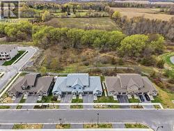 Aerial view of townhomes and green space/trails - 