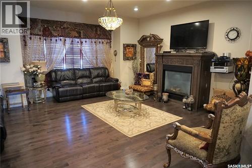 319 Roy Crescent, Saskatoon, SK - Indoor Photo Showing Living Room With Fireplace
