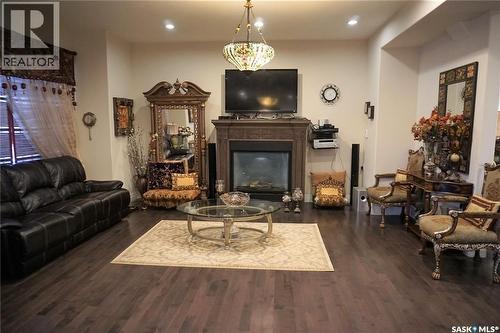 319 Roy Crescent, Saskatoon, SK - Indoor Photo Showing Living Room With Fireplace