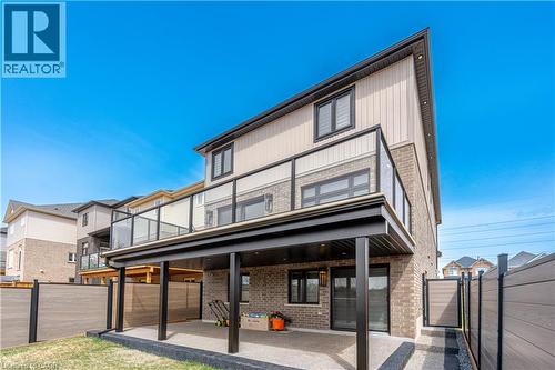 Rear view of property with a gate, brick siding, a fenced backyard, and a patio area - 477 Blair Creek Drive, Kitchener, ON - Outdoor