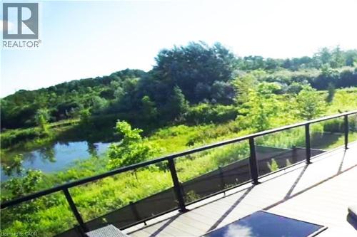 Balcony with a wooded view and a water view - 477 Blair Creek Drive, Kitchener, ON - Outdoor With View