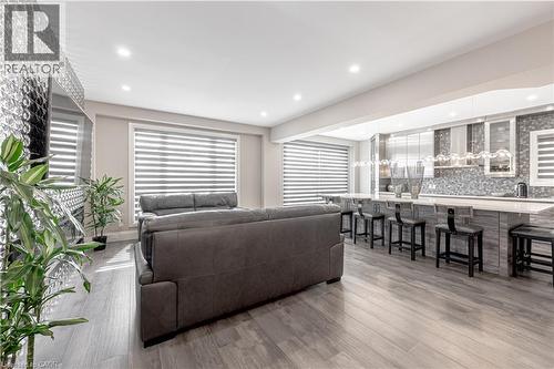 Living room with recessed lighting, plenty of natural light, and wood finished floors - 477 Blair Creek Drive, Kitchener, ON - Indoor Photo Showing Living Room